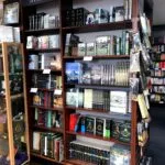 A bookcase full of JRR Tolkien's works.