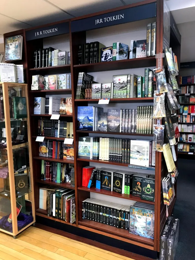 A bookcase full of JRR Tolkien's works.